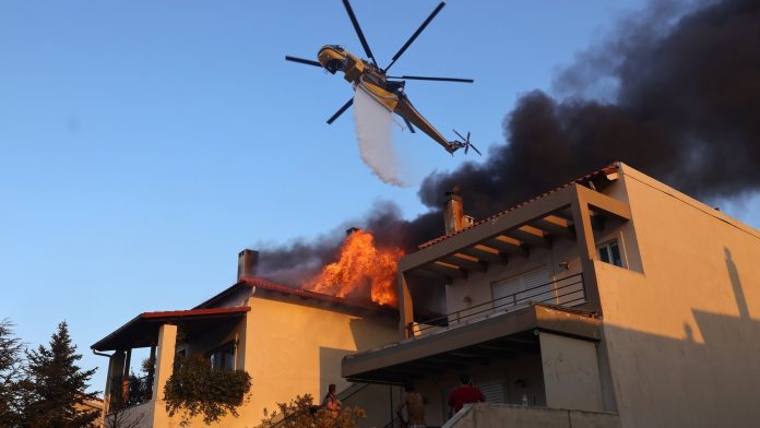 Further evacuations as Greece battles raging wildfires Further evacuations as Greece battles raging wildfires