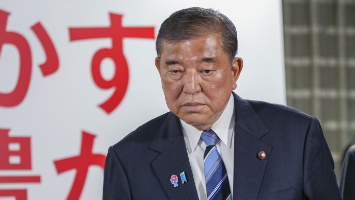 Japanese PM vows to stay on after poor election result