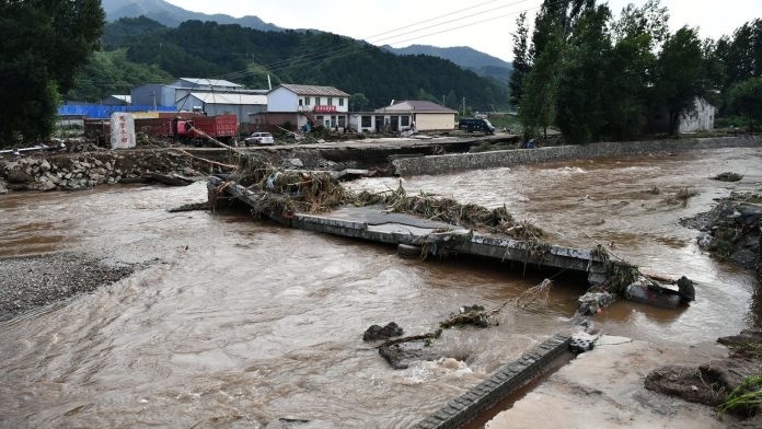 Thirty dead as China hit by heavy rain, landslides