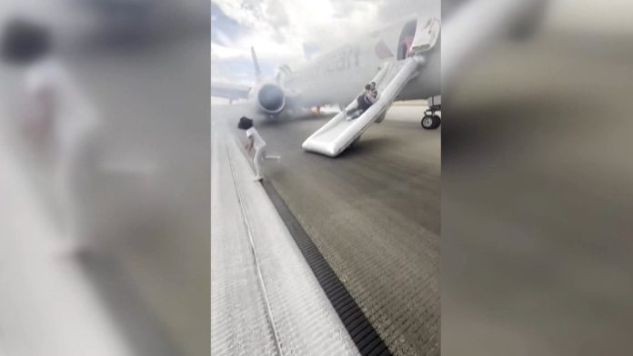 Watch: Passengers use slides to flee fire on US plane