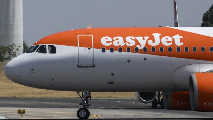 EasyJet flight reverses course after man attempts to access cockpit EasyJet flight in U-turn after man tries to enter cockpit