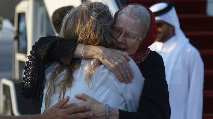 British couple with family after being freed by Taliban