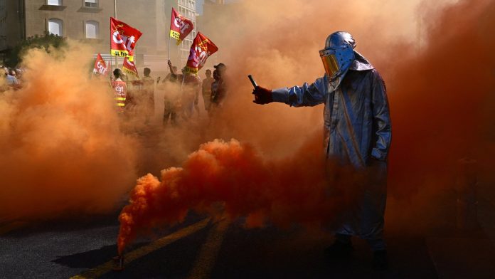 French unions strike against austerity, pressuring Macron