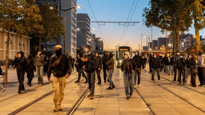 French unions strike against austerity, pressuring Macron
