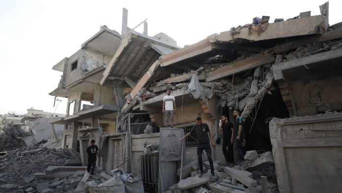 Israeli attacks kill 12 as UN condemns mass killing
