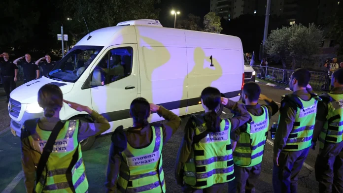 Hamas hands over bodies after Israel threatens aid cuts