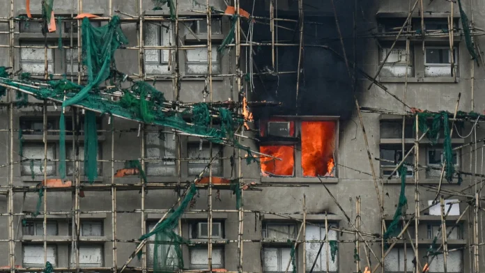 Hong Kong fire kills 55 as police blame construction firm