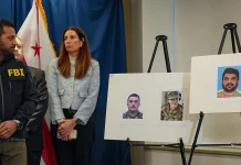 FBI Searches Homes After Two National Guard Members Are Shot FBI raids homes after two National Guard members shot