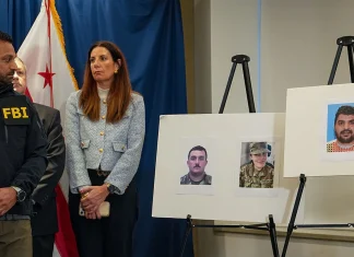 FBI Searches Homes After Two National Guard Members Are Shot FBI raids homes after two National Guard members shot