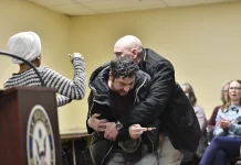 Ilhan Omar doused with unknown substance while delivering speech Ilhan Omar sprayed by unknown substance during speech