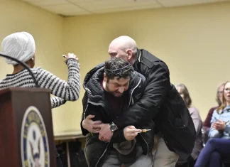 Ilhan Omar doused with unknown substance while delivering speech Ilhan Omar sprayed by unknown substance during speech