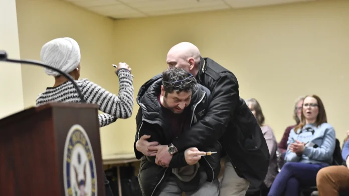 Ilhan Omar sprayed by unknown substance during speech