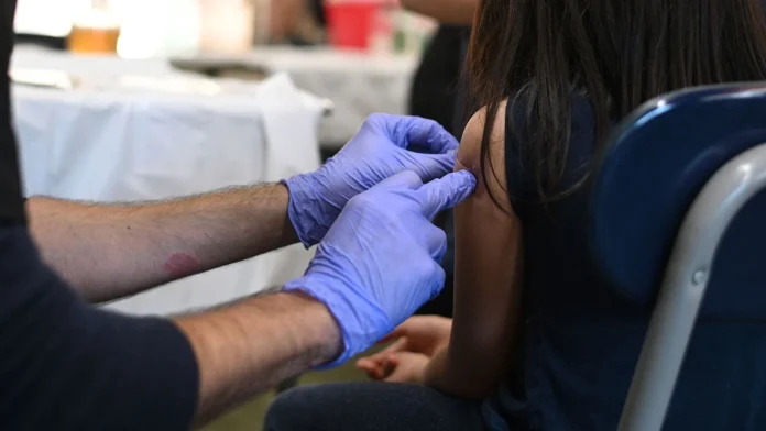 US cuts broad recommendation for four childhood vaccines