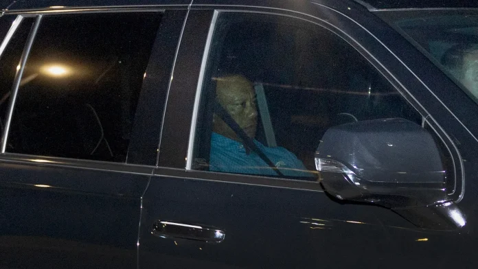 Woods told police he was looking at phone before crash