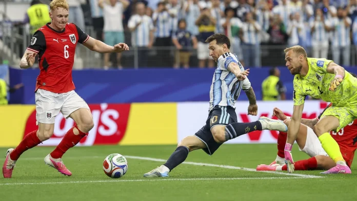 Record-breaking Messi sends Argentina into last 32