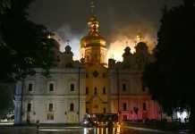 Russian attacks kill 11 and ignite historic monastery in Kyiv Russian strikes kill 11 and set Kyiv monastery alight