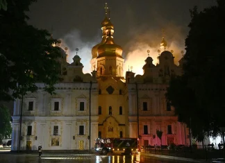 Russian attacks kill 11 and ignite historic monastery in Kyiv Russian strikes kill 11 and set Kyiv monastery alight