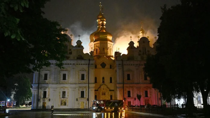 Russian attacks kill 11 and ignite historic monastery in Kyiv Russian strikes kill 11 and set Kyiv monastery alight