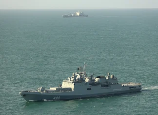 Russian vessel fires warning shots at yacht off UK waters Russian ship fires warning shots at yacht near UK waters