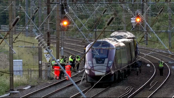 Train collision in the UK kills driver, leaves nine in Driver killed in UK train collision, nine critical