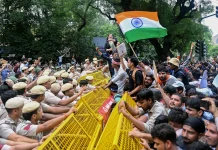 Indian Police Use Tear Gas and Batons to Disperse Exam Protesters Indian police fire tear gas, baton charge exam protesters