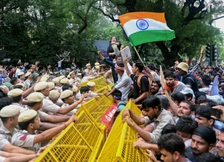Indian Police Use Tear Gas and Batons to Disperse Exam Protesters Indian police fire tear gas, baton charge exam protesters