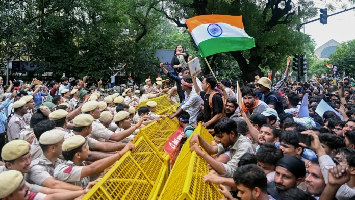 Indian Police Use Tear Gas and Batons to Disperse Exam Indian police fire tear gas, baton charge exam protesters