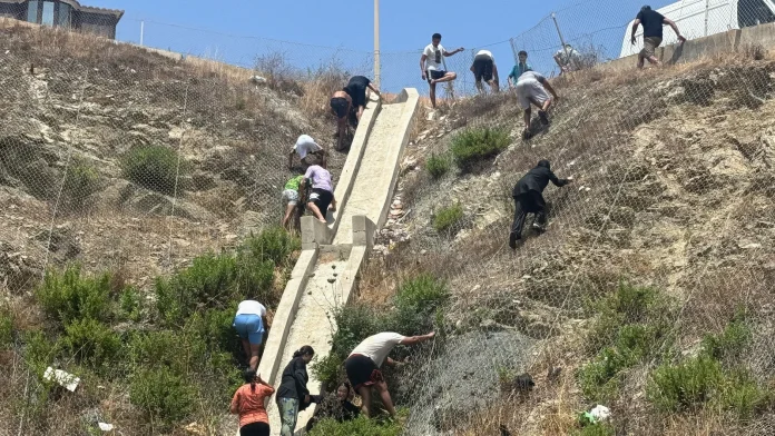 Migrants breach Spanish border as military forces are deployed Migrants break through Spanish border, military deployed