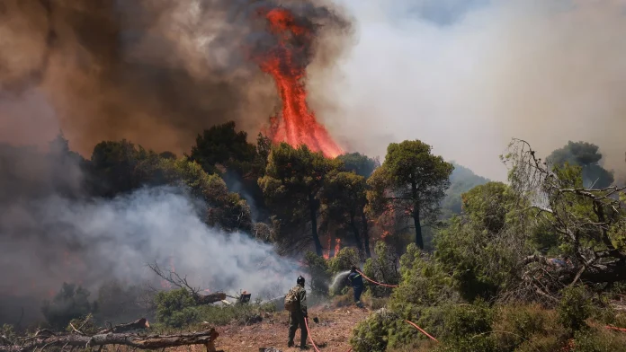 Two helicopters crash in Greece amid rapidly spreading wildfires Two helicopters collide in Greece as wildfires spread