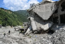 Families Rally in Nepal as Flood Victim Search Effort Ends Families protest as Nepal ends search for flood victims